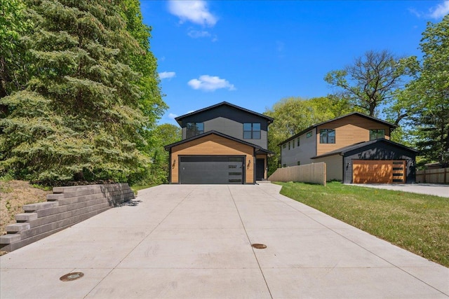 3822 Northern Ave, Spring Park, MN 55384 - contemporary house featuring a garage and concrete driveway