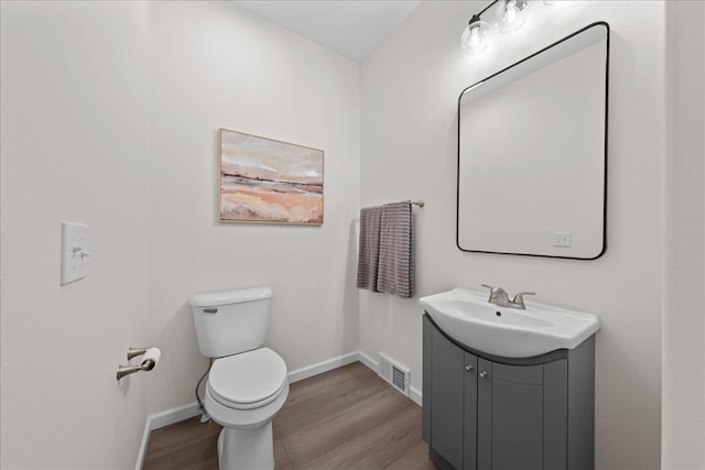 3822 Northern Ave, Spring Park, MN 55384 - half bath featuring wood finished floors, vanity, toilet, and baseboards