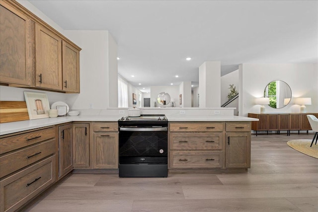 3822 Northern Ave, Spring Park, MN 55384 - kitchen with electric stove, a peninsula, light wood-style flooring, light countertops, and recessed lighting