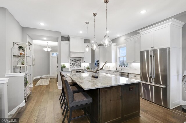 13714 Park Haven Trl NE, Prior Lake, MN 55372 - kitchen featuring stainless steel appliances, dark wood-type flooring, backsplash, white cabinets, and recessed lighting