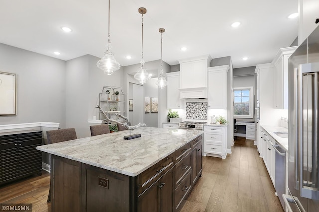 13714 Park Haven Trl NE, Prior Lake, MN 55372 - kitchen featuring dishwasher, white cabinets, dark brown cabinets, hardwood / wood-style floors, and recessed lighting