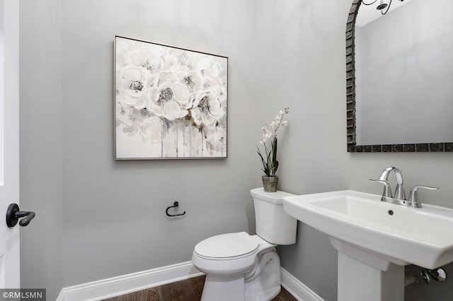 13714 Park Haven Trl NE, Prior Lake, MN 55372 - bathroom with baseboards, wood finished floors, toilet, and a sink