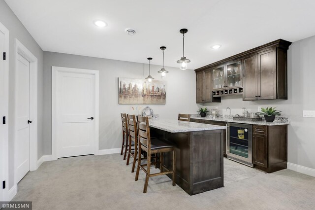 13714 Park Haven Trl NE, Prior Lake, MN 55372 - indoor wet bar with beverage cooler, baseboards, light colored carpet, hanging light fixtures, and recessed lighting