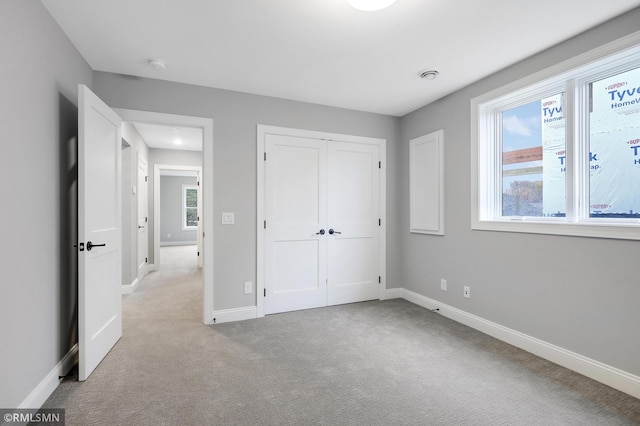 13714 Park Haven Trl NE, Prior Lake, MN 55372 - unfurnished bedroom with baseboards, carpet floors, and a closet