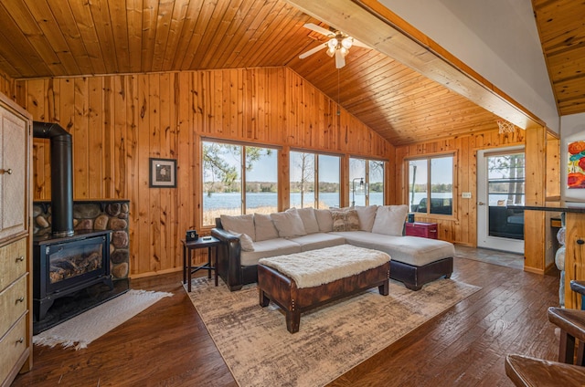 19490 Ruff Shores Rd, Harris Twp, MN 55744 - living area with vaulted ceiling, wooden walls, wooden ceiling, dark wood-style floors, and a water view