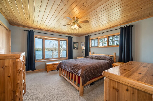 19490 Ruff Shores Rd, Harris Twp, MN 55744 - bedroom featuring wood ceiling, light carpet, crown molding, a water view, and a ceiling fan