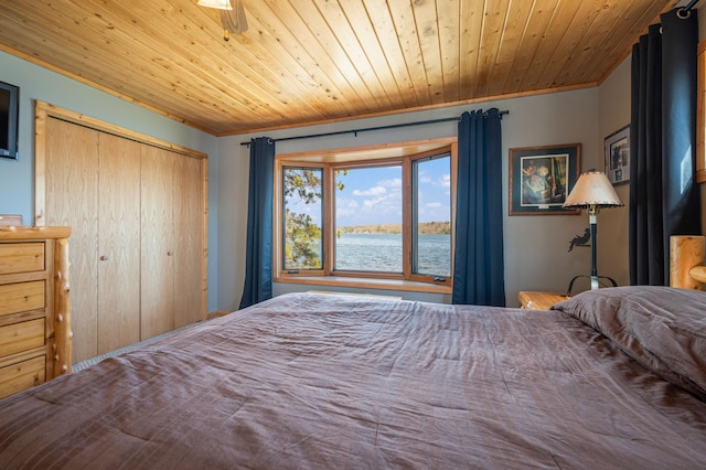 19490 Ruff Shores Rd, Harris Twp, MN 55744 - bedroom with wood ceiling, a water view, a closet, and ornamental molding