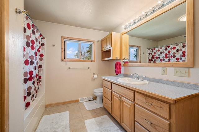 19490 Ruff Shores Rd, Harris Twp, MN 55744 - full bathroom featuring toilet, tile patterned floors, vanity, baseboards, and shower / tub combo