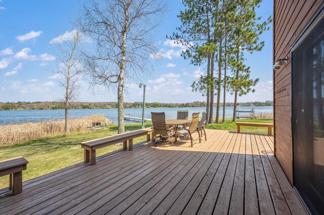 19490 Ruff Shores Rd, Harris Twp, MN 55744 - wooden terrace featuring a lawn, outdoor dining space, and a water view