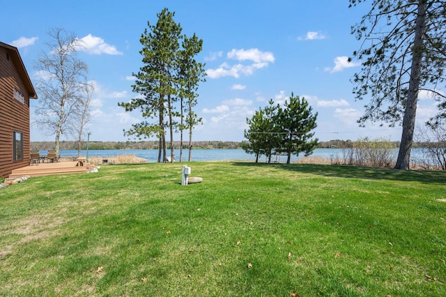 19490 Ruff Shores Rd, Harris Twp, MN 55744 - view of grassy yard featuring a deck with water view