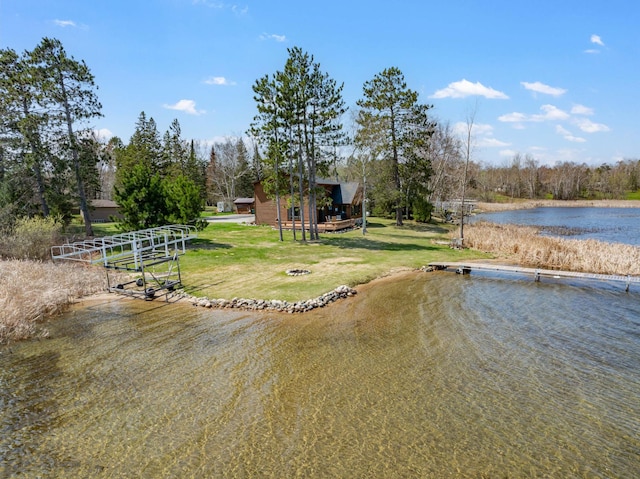 19490 Ruff Shores Rd, Harris Twp, MN 55744 - dock area with a water view and a yard