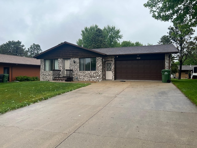 1950 Summit Ave, Worthington, MN 56187 - ranch-style home featuring a garage, a front yard, concrete driveway, and brick siding
