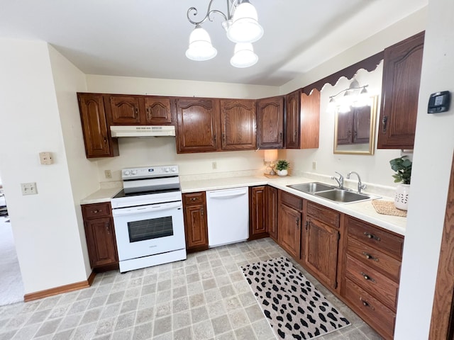 1950 Summit Ave, Worthington, MN 56187 - kitchen featuring white appliances, a sink, under cabinet range hood, a chandelier, and light countertops