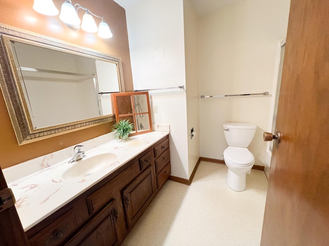 1950 Summit Ave, Worthington, MN 56187 - full bath featuring vanity, toilet, and baseboards
