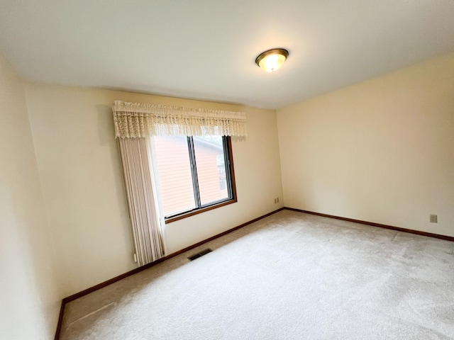 1950 Summit Ave, Worthington, MN 56187 - unfurnished room with light colored carpet and baseboards