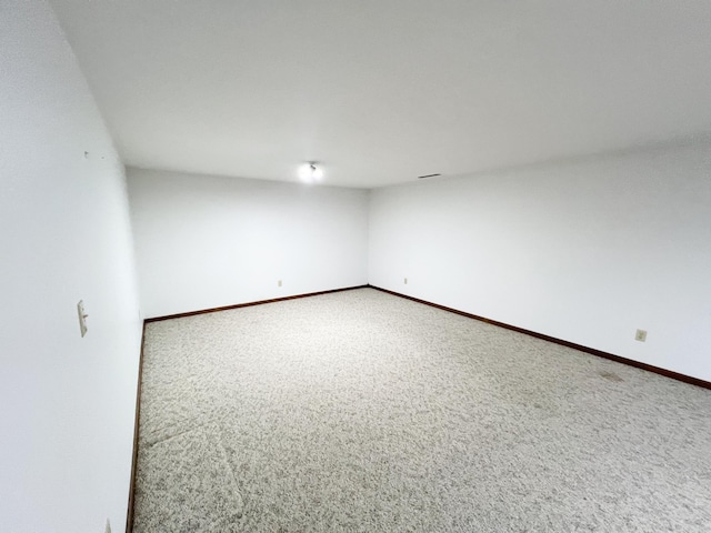 1950 Summit Ave, Worthington, MN 56187 - unfurnished room featuring carpet floors and baseboards