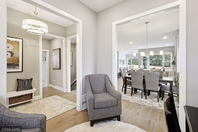 4104 Osprey Ct, Prior Lake, MN 55372 - living area with a chandelier, light wood finished floors, and baseboards