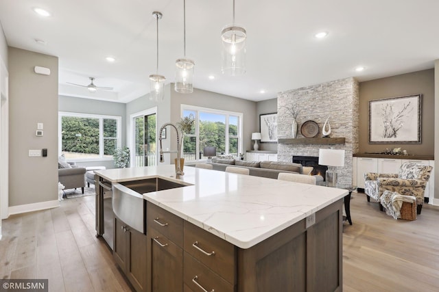 4104 Osprey Ct, Prior Lake, MN 55372 - kitchen with a sink, open floor plan, light wood-type flooring, stainless steel dishwasher, and a ceiling fan