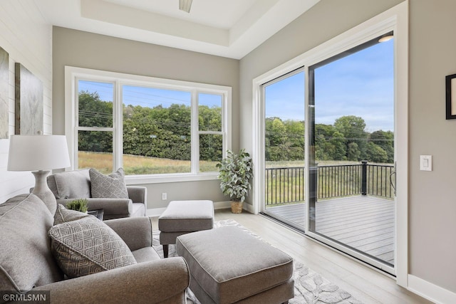 4104 Osprey Ct, Prior Lake, MN 55372 - sunroom featuring wood finished floors, baseboards, and a raised ceiling