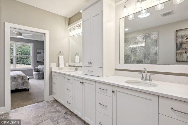 4104 Osprey Ct, Prior Lake, MN 55372 - full bath with marble look tiles, tiled shower, double vanity, ceiling fan, and ensuite bathroom