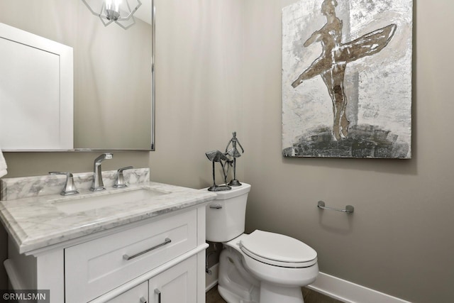 4104 Osprey Ct, Prior Lake, MN 55372 - bathroom featuring baseboards, toilet, and vanity