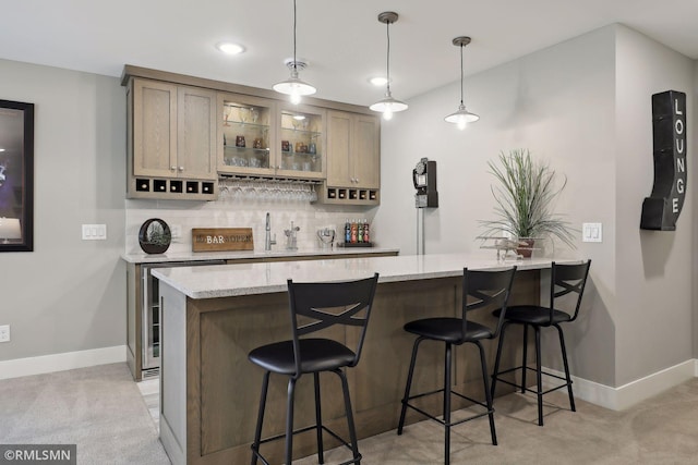 4104 Osprey Ct, Prior Lake, MN 55372 - indoor wet bar with light carpet, baseboards, backsplash, recessed lighting, and decorative light fixtures