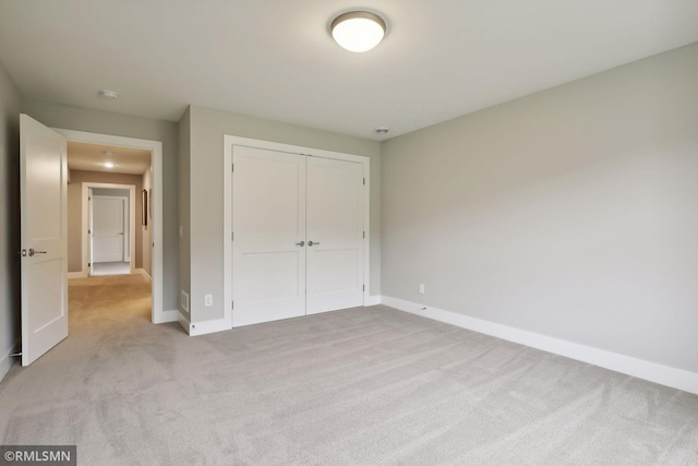 4104 Osprey Ct, Prior Lake, MN 55372 - unfurnished bedroom featuring light colored carpet, baseboards, and a closet