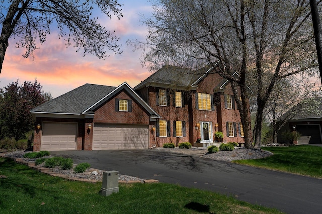 13642 44th St NE, Saint Michael, MN 55376 - view of front of property with brick siding, asphalt driveway, a garage, and a front yard