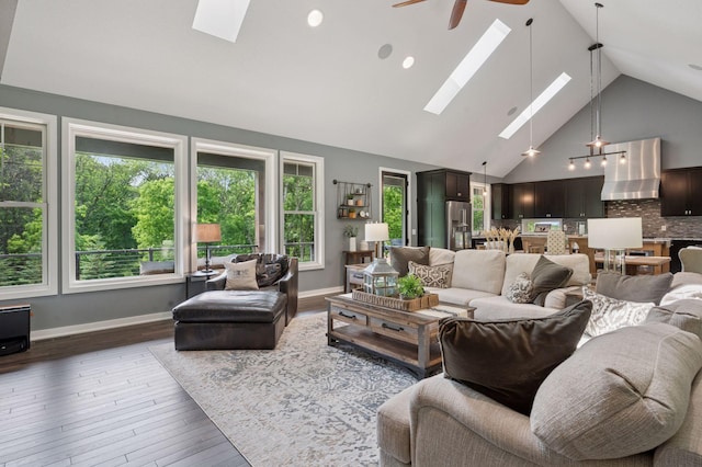 1701 Retreat Cir, Minnetrista, MN 55364 - living area with a skylight, high vaulted ceiling, ceiling fan, and hardwood / wood-style flooring