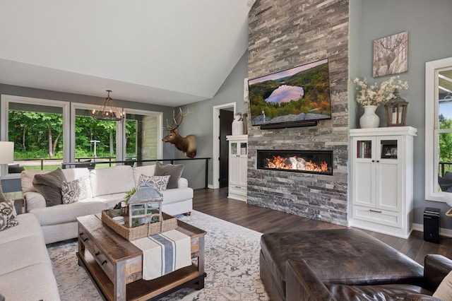 1701 Retreat Cir, Minnetrista, MN 55364 - living area with a stone fireplace, wood finished floors, and high vaulted ceiling