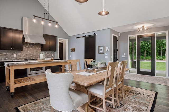 1701 Retreat Cir, Minnetrista, MN 55364 - dining area with high vaulted ceiling, a barn door, and dark wood-type flooring