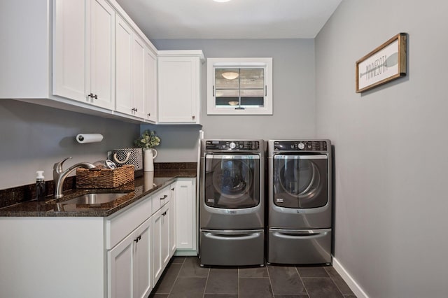 1701 Retreat Cir, Minnetrista, MN 55364 - washroom featuring cabinet space, separate washer and dryer, and dark tile patterned flooring