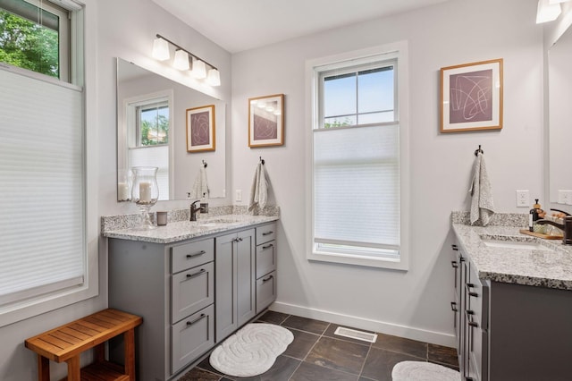 1701 Retreat Cir, Minnetrista, MN 55364 - full bathroom featuring plenty of natural light, two vanities, and tile patterned flooring