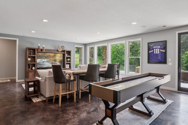 1701 Retreat Cir, Minnetrista, MN 55364 - rec room featuring recessed lighting, concrete flooring, and a textured ceiling