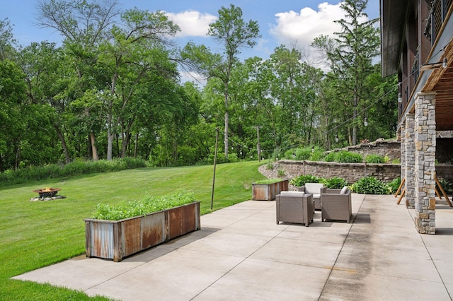 1701 Retreat Cir, Minnetrista, MN 55364 - view of patio / terrace featuring an outdoor fire pit and view of wooded area