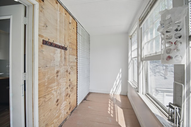 733 1st St SW, Faribault, MN 55021 - hallway featuring hardwood / wood-style flooring and baseboards
