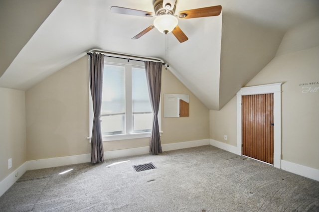 733 1st St SW, Faribault, MN 55021 - bonus room featuring carpet floors, lofted ceiling, a ceiling fan, and baseboards