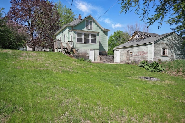 733 1st St SW, Faribault, MN 55021 - back of property featuring a chimney and a yard