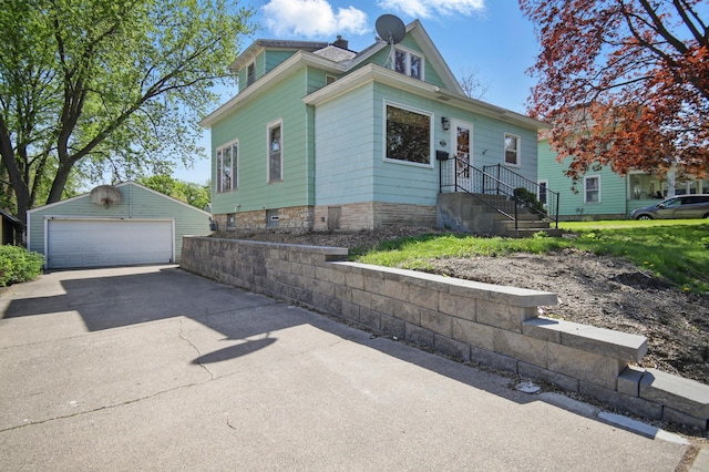 733 1st St SW, Faribault, MN 55021 - view of front of property with an outdoor structure and a detached garage