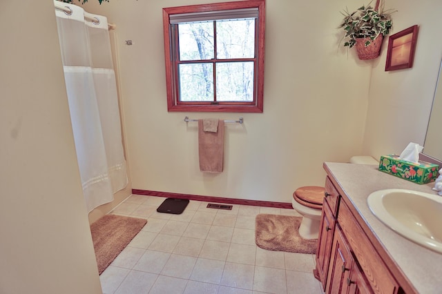 127 County Rd W, Pleasant Valley Twp, WI 54022 - bathroom with toilet, tile patterned floors, vanity, and baseboards