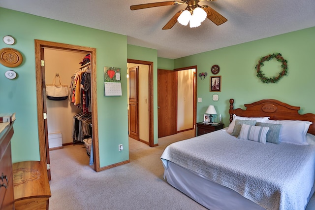 127 County Rd W, Pleasant Valley Twp, WI 54022 - bedroom featuring a spacious closet, a closet, light colored carpet, baseboards, and a ceiling fan