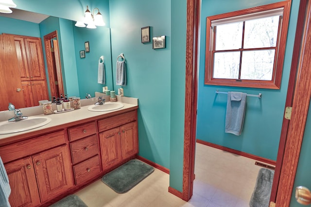 127 County Rd W, Pleasant Valley Twp, WI 54022 - full bathroom with double vanity and baseboards