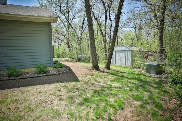 127 County Rd W, Pleasant Valley Twp, WI 54022 - view of green lawn featuring a storage shed and an outdoor structure