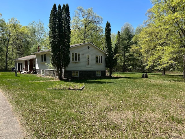 25622 Blue Bonnet Rd, Center Twp, MN 56465 - view of side of home featuring a yard and a chimney