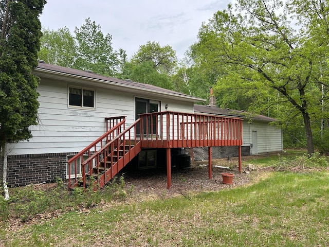 25622 Blue Bonnet Rd, Center Twp, MN 56465 - rear view of house featuring a wooden deck, central AC, and stairs