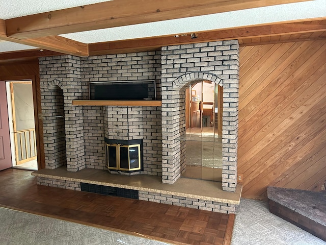 25622 Blue Bonnet Rd, Center Twp, MN 56465 - unfurnished living room with a brick fireplace, wooden walls, beam ceiling, and arched walkways