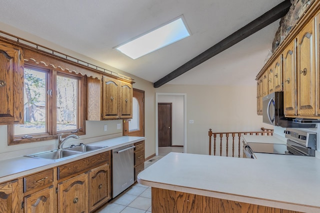 kitchen with stainless steel appliances, a sink, light countertops, brown cabinetry, and lofted ceiling