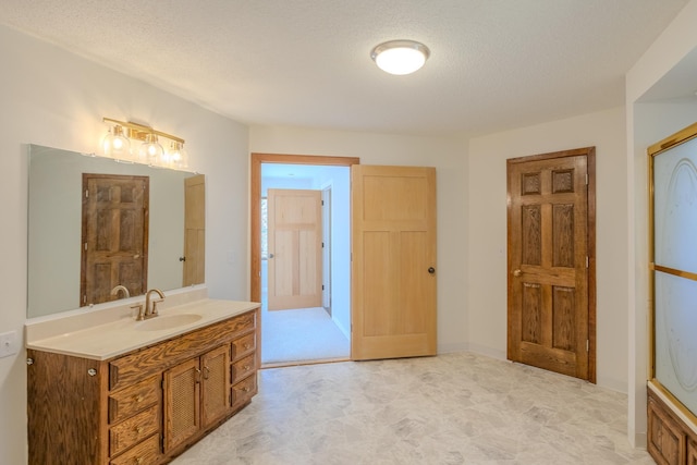 bathroom featuring vanity and a textured ceiling