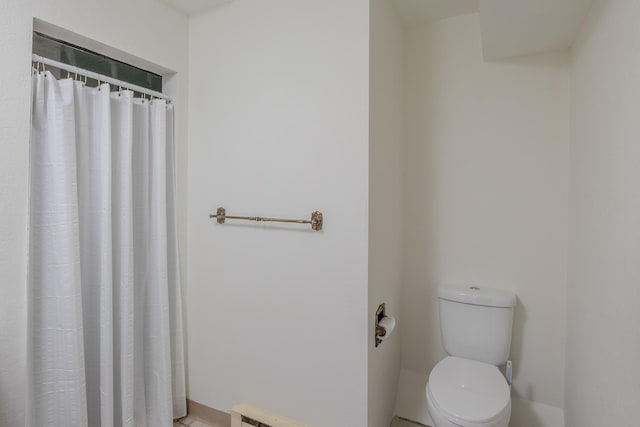 full bathroom with toilet and curtained shower