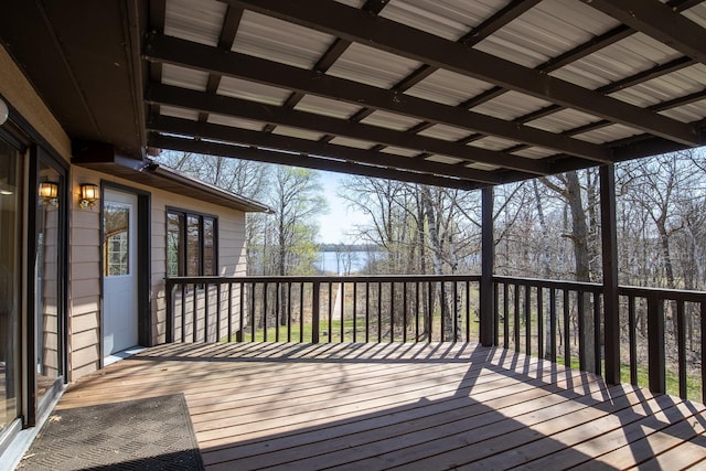 wooden deck featuring a water view